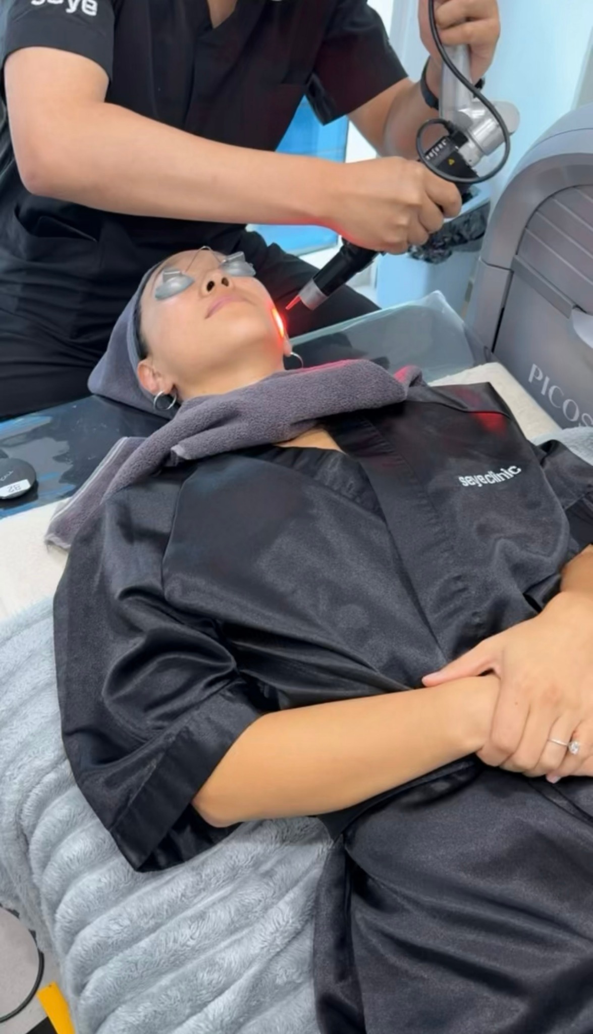Eunice receiving facial laser treatment